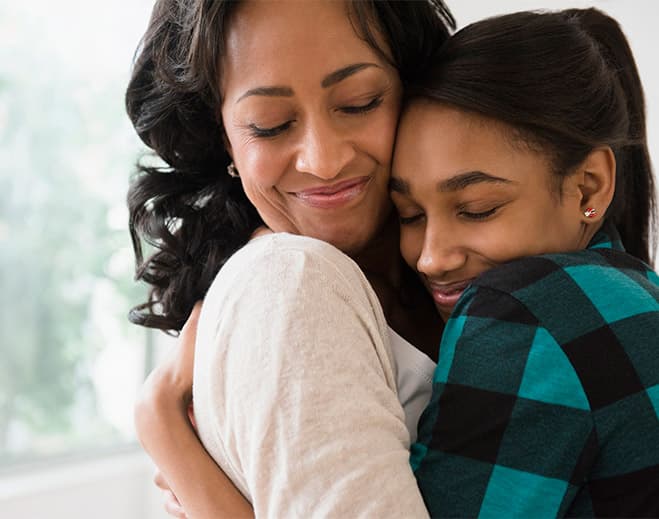 Mom and daughter hugging